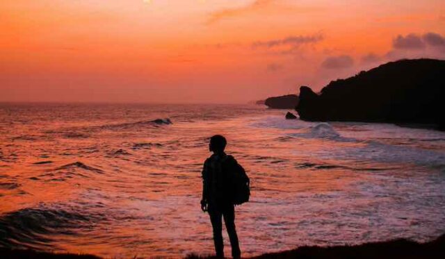 On a beach at sunset